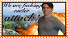 A stamp with Jerma in his 'Sparkle on' pose with explosions in the background, it says 'We are fucking under attack!'.